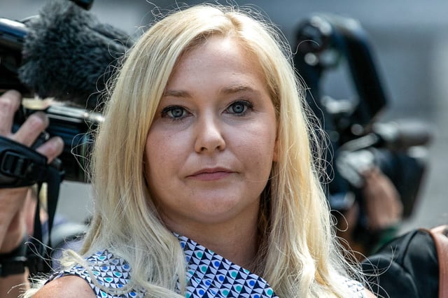 Virginia Giuffre, an alleged victim of Jeffrey Epstein, center, exits from federal court in New York, on Aug. 27, 2019.