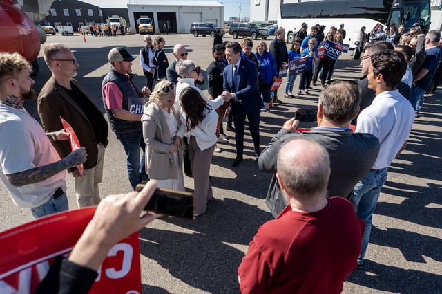 Leader of the Conservative Party of Canada Pierre Poilievre shakes hands on the tarmac before entering his plane in Saskatoon, Sask., Friday, April 25, 2025. THE CANADIAN PRESS/Liam Richards