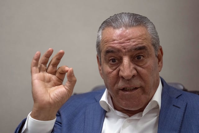 FILE - Hussein al-Sheikh, secretary-general of the Executive Committee of the Palestine Liberation Organization, gestures during an interview with The Associate Press at his office in the West Bank city of Ramallah, June 13, 2022. (AP Photo/Nasser Nasser, File)