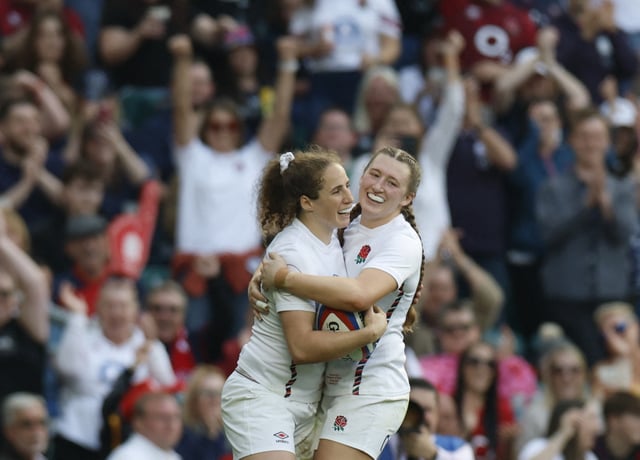 Rugby Union - Women's Six Nations - England v France - Allianz Stadium, Twickenham, London, Britain - April 26, 2025 England's Abby Dow celebrates with Emma Sing after scoring their seventh try Action Images via Reuters/Peter Cziborra