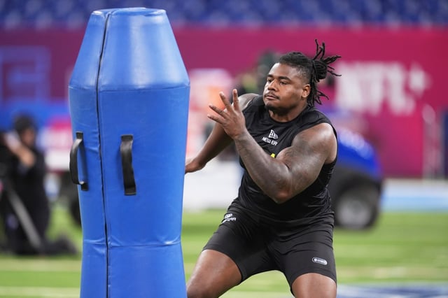 Ohio State defensive lineman Ty Hamilton runs a drill at the NFL football scouting combine Feb. 27, 2025, in Indianapolis. (AP Photo/Michael Conroy)