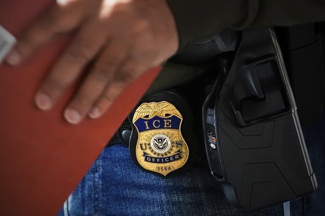 FILE - A deportation officer with Enforcement and Removal Operations in U.S. Immigration and Customs Enforcement's New York City field office conducts a brief before an early morning operation, Tuesday, Dec. 17, 2024, in the Bronx borough of New York. (AP Photo/Julia Demaree Nikhinson, File)