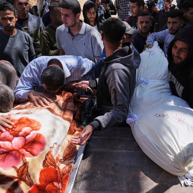 Palestinians mourn over the bodies of their relatives who were killed in an Israeli airstrike, as they brought to Shifa Hospital in Gaza City, on Saturday, April 26, 2025. (AP Photo/Jehad Alshrafi)