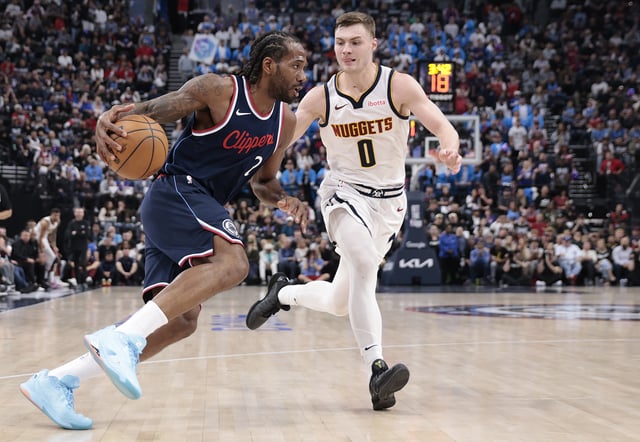 Kawhi Leonard #2 of the Los Angeles Clippers dribbles the ball against Christian Braun #0 of the Denver Nuggets during the second quarter in Game Three of the Western Conference First Round NBA Playoffs at Intuit Dome on April 24, 2025 in Inglewood, California.