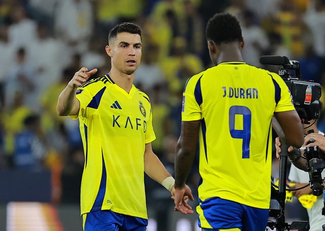 Soccer Football - Asian Champions League - Quarter Final - Yokohama F Marinos v Al Nassr - Prince Abdullah Al-Faisal Sports City Stadium, Jeddah, Saudi Arabia - April 26, 2025 Al Nassr's Cristiano Ronaldo celebrates with Jhon Duran after the match REUTERS/Stringer