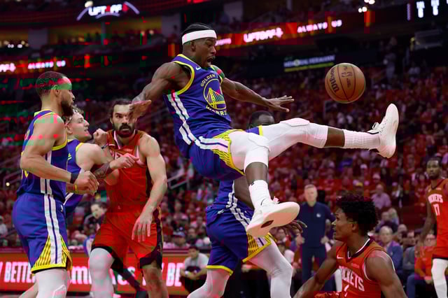 Jimmy Butler III #10 of the Golden State Warriors is fouled by Amen Thompson #1 of the Houston Rockets in the first half in Game Two of the Western Conference First Round NBA Playoffs at Toyota Center on April 23, 2025 in Houston, Texas.