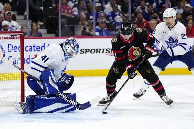 Ottawa Senators' Adam Gaudette (81) looks for a shot on Toronto Maple Leafs goaltender Anthony Stolarz (41) as Brandon Carlo (25) defends, during second period NHL playoff action in Ottawa, on Saturday, April 26, 2025. THE CANADIAN PRESS/Justin Tang