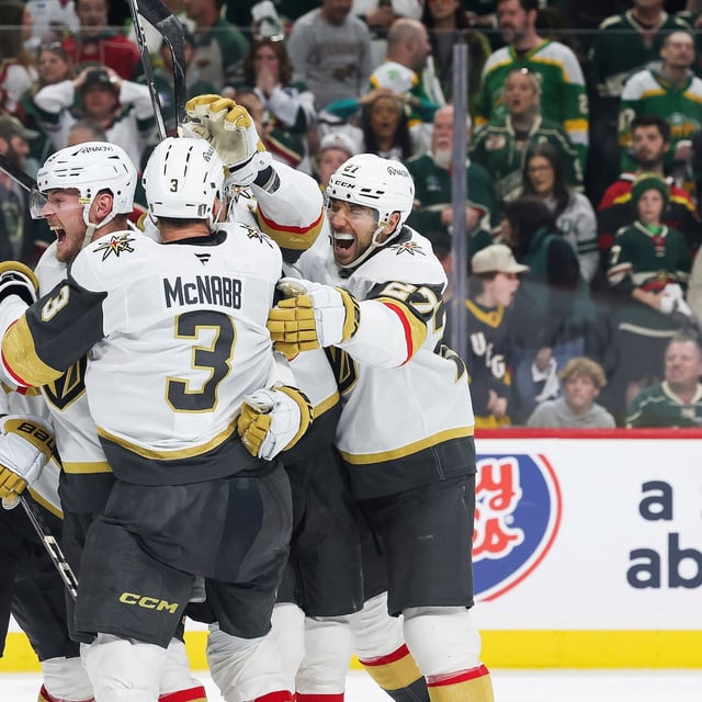 Vegas Golden Knights center Ivan Barbashev (49) celebrates with teammates after scoring a goal the winning goal during overtime in Game 4 of an NHL hockey Stanley Cup first-round playoff series against the Minnesota Wild, Saturday, April 26, 2025, in St. Paul, Minn. (AP Photo/Stacy Bengs)