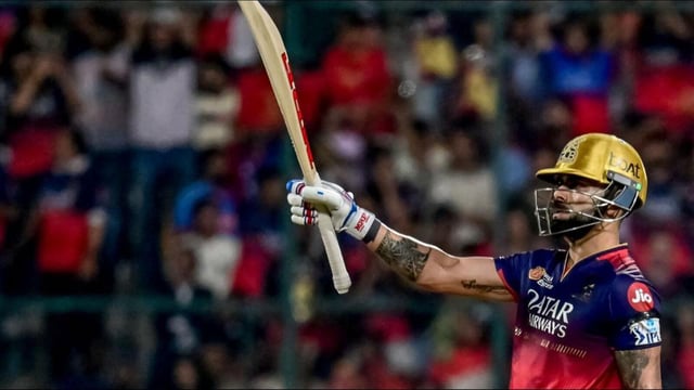Royal Challengers Bengaluru's Virat Kohli celebrates after scoring a half-century- (AFP)