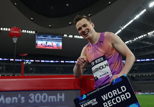 Athletics - Diamond League - Xiamen - Xiamen Egret Stadium, Xiamen, China - April 26, 2025 Norway's Karsten Warholm celebrates after setting a new world record in the men's 300m hurdles REUTERS/Go Nakamura