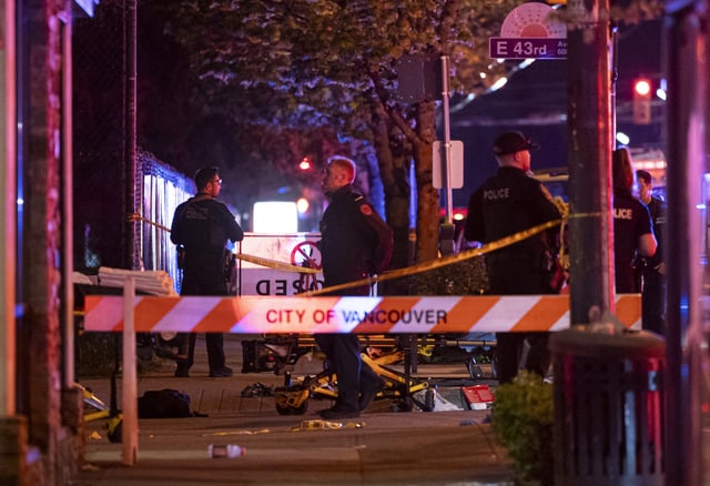 Vancouver police secure the scene after a car drove into a crowd at the Lapu Lapu Festival in Vancouver, British Columbia, Saturday April 26, 2025. (Rich Lam/The Canadian Press via AP)