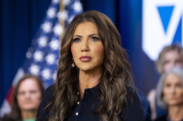 Homeland Security Secretary Kristi Noem speaks during a news conference to announce the re-launch of the VOICE office, Victims of Immigration Crime Engagement, with families of victims behind her, at the Immigration and Customs Enforcement headquarters, Wednesday, April 9, 2025, in Washington.
