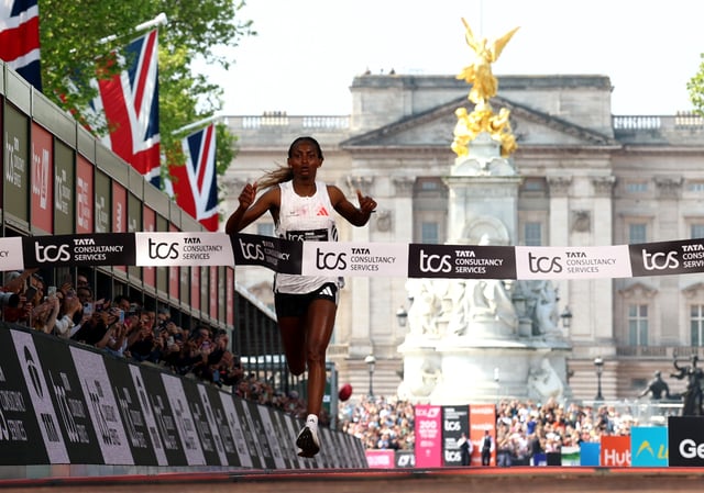 Athletics - London Marathon - London, Britain - April 27, 2025 Ethiopia's Tigst Assefa crosses the finish line to win the women's elite race Action Images via Reuters/Matthew Childs