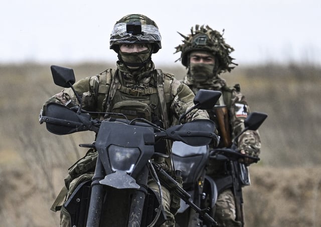 Recruits of the 1430th Guards Motorised Rifle Regiment ride motorbikes during combat training in the Zaporizhzhia sector of the frontline on October 18, 2024. This image was provided to AP by a third party and could not be independently verified.