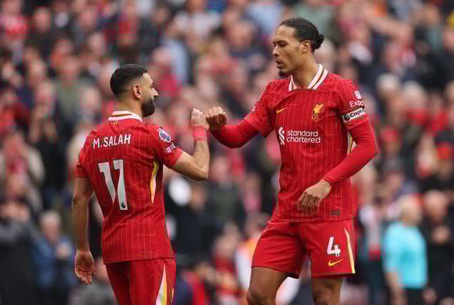 Mohamed Salah of Liverpool celebrates scoring his team&#39;s second goal with teammate Virgil van Dijk during the Premier League match between Liverpool FC and Southampton FC at Anfield on March 08, 2025 in Liverpool, England.