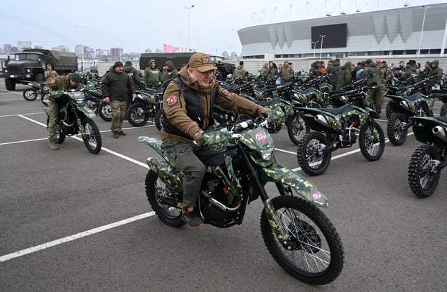 Participants attend a ceremony to hand over new motocross bikes to the Russian military near a football stadium in Rostov-on-Don, Russia, November 28, 2024.