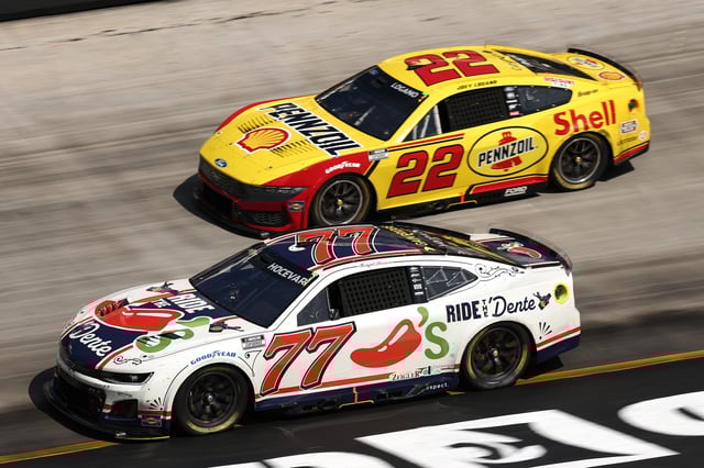 Carson Hocevar, driver of the #77 Chili&#39;s Ride the &#39;Dente Chevrolet, races Joey Logano, driver of the #22 Shell-Pennzoil Ford, during the NASCAR Cup Series Food City 500 at Bristol Motor Speedway on April 13, 2025 in Bristol, Tennessee.