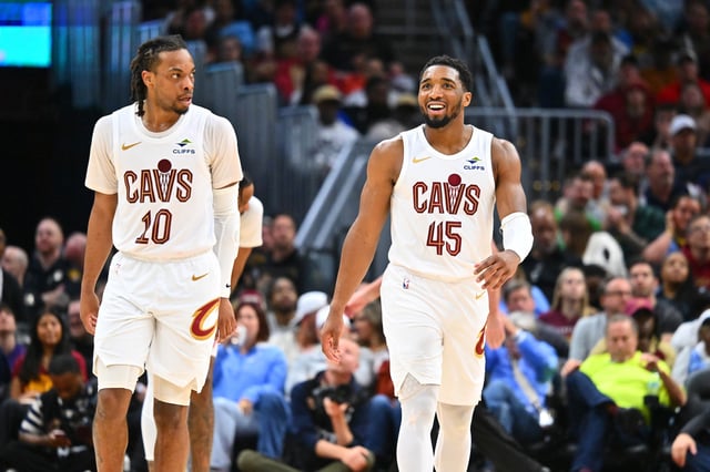 Darius Garland #10 and Donovan Mitchell #45 of the Cleveland Cavaliers celebrate during the fourth quarter against the LA Clippers at Rocket Arena on March 30, 2025 in Cleveland, Ohio. The Cavaliers defeated the Clippers 127-122.