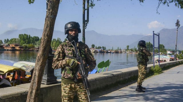 Security personnel keep vigil near the Dal Lake in Srinagar. (PTI)