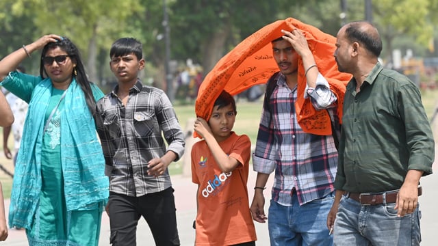People out on a hot afternoon at Kartavya Path, in New Delhi, India, on Sunday, April 27, 2025.