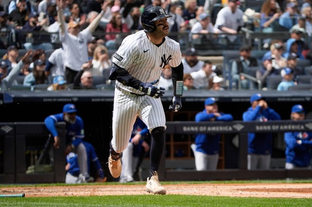 New York Yankees’ Austin Wells watches his three-run double during the third inning of the first baseball game of a doubleheader against the Toronto Blue Jays, Sunday, April 27, 2025, in New York. (AP Photo/Pamela Smith)