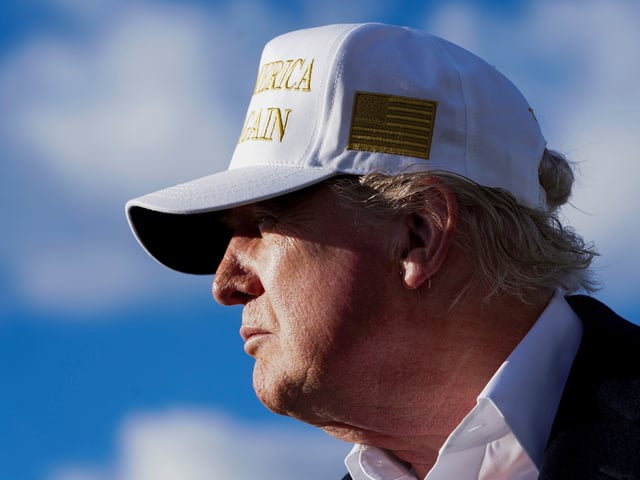 U.S. President Donald Trump looks on before boarding Air Force One en route to Washington, D.C, at Morristown Municipal Airport in Morristown, New Jersey, U.S., April 27, 2025. REUTERS/Nathan Howard
