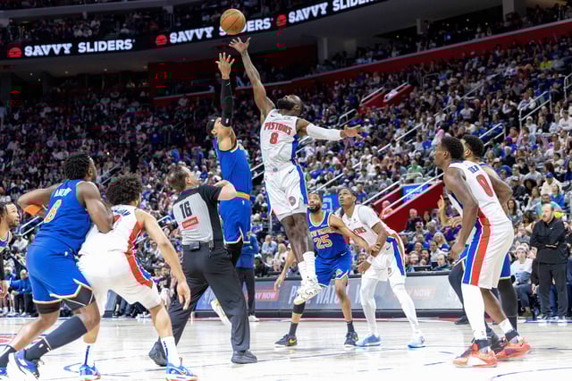 Apr 27, 2025; Detroit, Michigan, USA; Detroit Pistons forward Tim Hardaway Jr. (8) has a jump ball against New York Knicks guard Josh Hart (3) during the second quarter of game four of first round for the 2025 NBA Playoffs at Little Caesars Arena. Mandatory Credit: David Reginek-Imagn Images