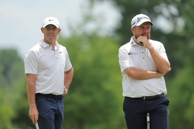 Rory McIlroy of Northern Ireland and Shane Lowry of Ireland speak on day four of the Zurich Classic of New Orleans on April 27, 2025