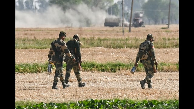 Indian Border Security Force (BSF) soldiers return to their BSF camp near Daoke village, about 45 km from Amritsar, on April 27 (AFP)