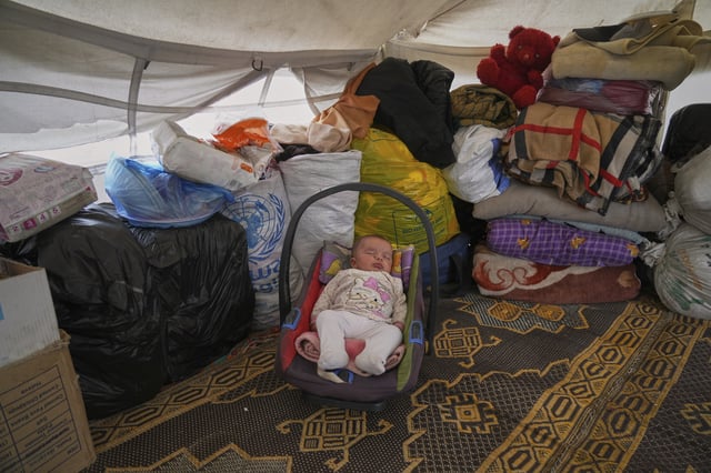 3-month-old, Jilan Zarrouk sleeps at a makeshift tent camp for displaced Palestinians in Muwasi, outskirts of Khan Younis in the southern Gaza Strip, Wednesday, April 9, 2025. (AP Photo/Abdel Kareem Hana)