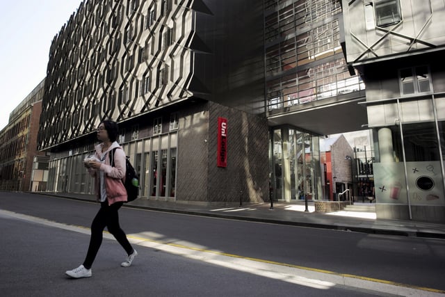 A student walks from high density housing near the campus of the University of Technology in Sydney, April 1, 2016. REUTERS/Jason Reed/File Photo