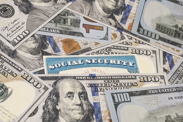 Stock image/file photo: A Social Security card with U.S. Dollars.