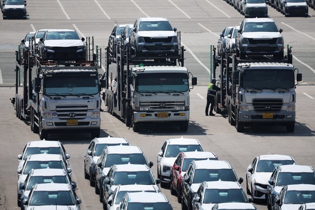 Car carriers transporting vehicles made by Kia Motors, which is part of South Korea's biggest automaker company Hyundai Motor, are parked at Pyeongtaek port in Pyeongtaek, South Korea, April 15, 2025. REUTERS/Kim Hong-Ji/File Photo