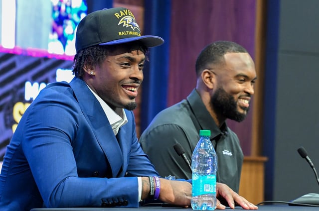 Safety Malaki Starks, left, the Baltimore Ravens’ first-round draft pick, speaks to the media alongside defensive coordinator Zach Orr during a press conference at the Under Armour Performance Center in Owings Mills, Md., on Friday. (Kevin Richardson/Staff)