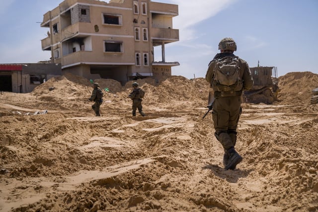 A picture released by the Israeli Army says to show Israeli soldiers conducting operations in a location given as Tel Al-Sultan area, Rafah Governorate, Gaza, in this handout image released April 2, 2025. Israeli Army/Handout via REUTERS