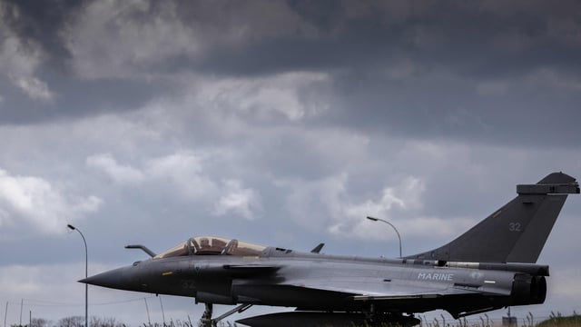 A French multirole fighter aircraft Rafale takes part in a practice session for a simulated landing on a aircraft carrier at the French Navy airbase of Landivisiau in Saint-Servais.