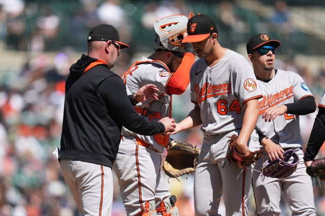 Baltimore Orioles manager Brandon Hyde takes the ball from pitcher Dean Kremer (64) against the Detroit Tigers in the sixth inning during a baseball game, Sunday, April 27, 2025, in Detroit. (AP Photo/Paul Sancya)