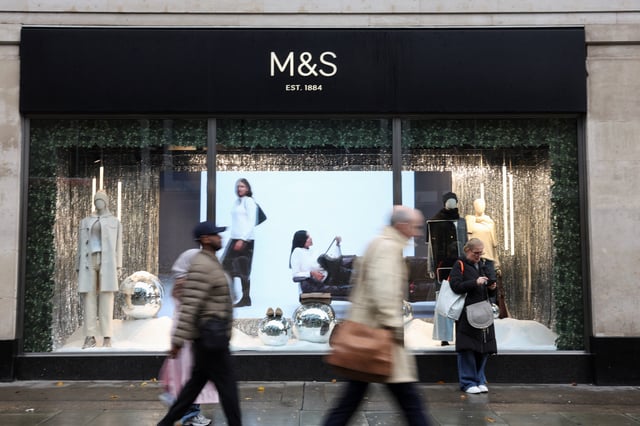 Passersby walk past a Marks & Spencer store near Marble Arch on Oxford Street, in London, Britain, December 5, 2024. REUTERS/Mina Kim/File Photo