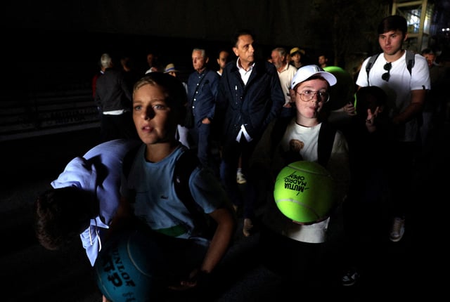 Tennis - Madrid Open - Park Manzanares, Madrid, Spain - April 28, 2025 Fans are seen after the matches get suspended due to a power outage REUTERS/Violeta Santos Moura