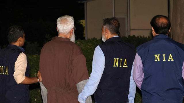 National Investigation Agency (NIA) officials along with Tahawwur Hussain Rana.