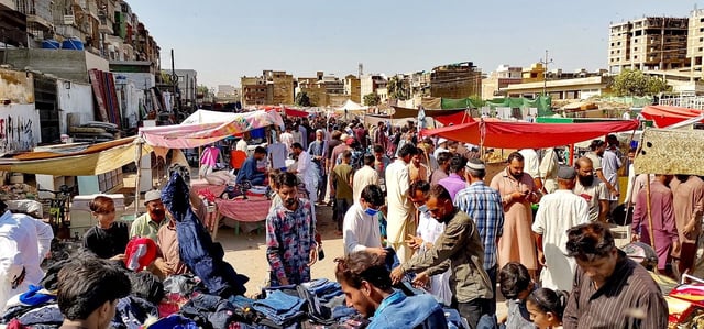 People are seen at a weekly Sunday bazaar in Bufferzone, an area of central Karachi of Sindh province in Pakistan