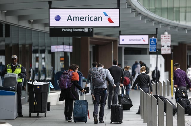 Passengers arrive at the American Airlines terminal at San Francisco International Airport on April 24, 2025 in San Francisco.