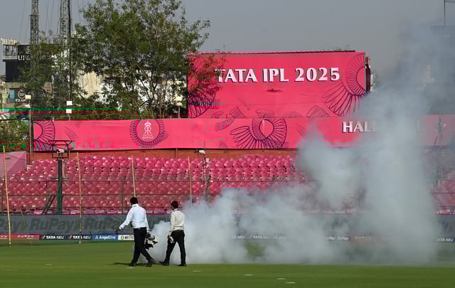 Cricket - Indian Premier League - IPL - Rajasthan Royals v Gujarat Titans - Sawai Mansingh Stadium, Jaipur, India - April 28, 2025 Ground staff spray mosquito foggers around the stadium before the match REUTERS/Abhijit Addya