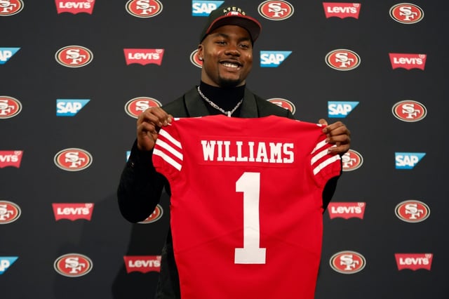 49ers 2025 First Round Draft Selection Mykel Williams holds up his jersey during a press conference at Levi’s Stadium in San Jose, Calif., on Friday, April 25, 2025. (Shae Hammond/Bay Area News Group)