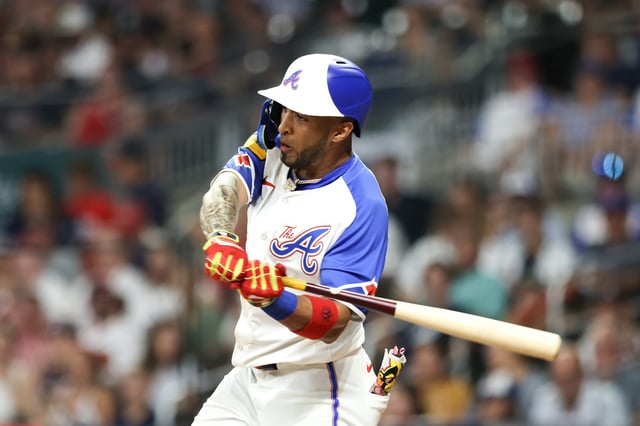 ATLANTA, GEORGIA - AUGUST 3: Eddie Rosario #8 of the Atlanta Braves hits a single during the sixth inning against the Miami Marlins at Truist Park on August 3, 2024 in Atlanta, Georgia.