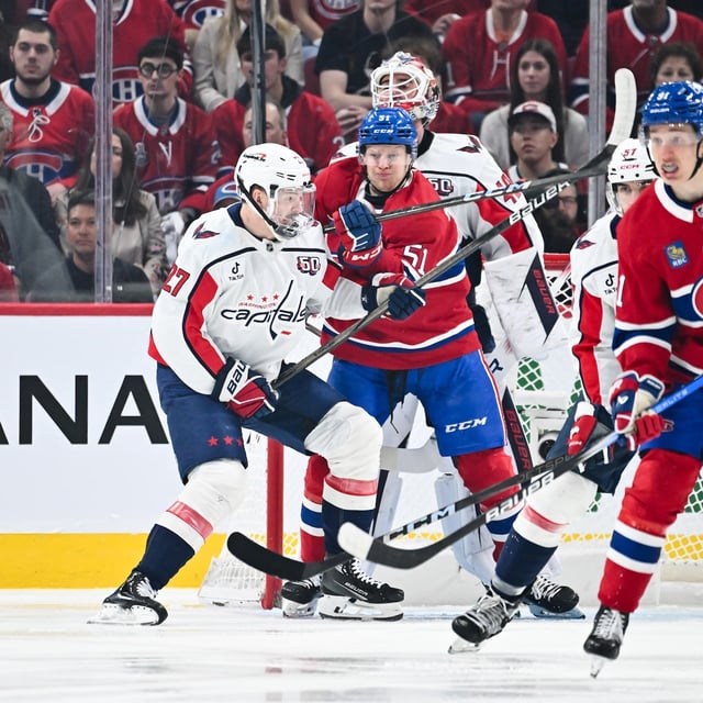 MONTREAL, CANADA - APRIL 27: Alexander Alexeyev #27 of the Washington Capitals and Emil Heineman #51 of the Montreal Canadiens battle for position during the first period in Game Four of the First Round of the 2025 Stanley Cup Playoffs at the Bell Centre on April 27, 2025 in Montreal, Quebec, Canada.  (Photo by Minas Panagiotakis/Getty Images)