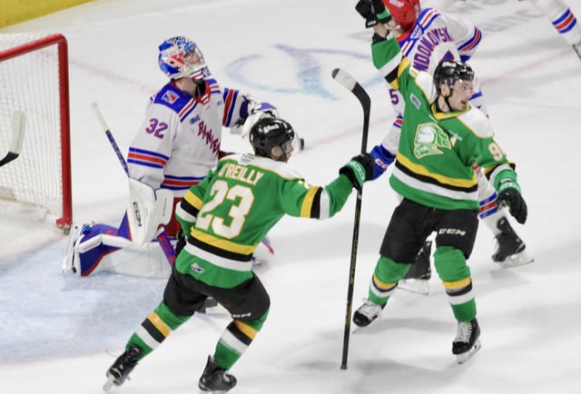 Landon Sim celebrates a second period goal for the London Knights with Sam O'Reilly in a 6-2 Knights win over the Kitchener Rangers in Game 2 of the Western Conference Championship on April 25, 2025.