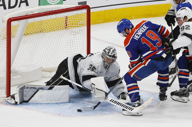 Apr 27, 2025; Edmonton, Alberta, CAN; Los Angeles Kings goaltender Darcy Kuemper (35) makes a save on  ion Edmonton Oilers forward Adam Henrique (19) during overtime in game four of the first round of the 2025 Stanley Cup Playoffs at Rogers Place. Mandatory Credit: Perry Nelson-Imagn Images/File Photo