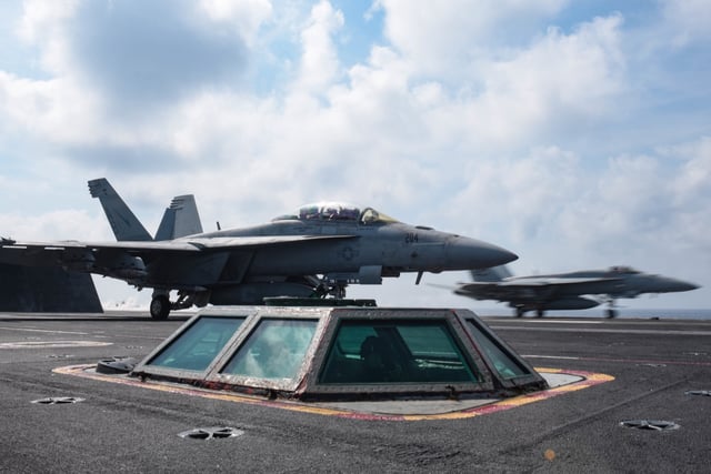 F/A-18E Super Hornet airplanes preparing to launch from the Nimitz-class aircraft carrier USS Harry S Truman (CVN 75), Mediterranean Sea, May 13, 2018.