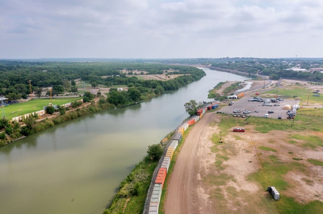  In an aerial view, the Rio Grande river runs alongside Shelby Park in Eagle Pass, Texas. 